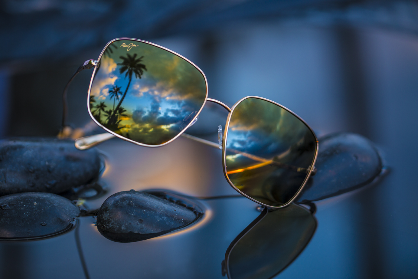 Triton sunglasses on rocks over water