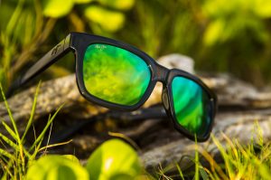 Mongoose sunglasses with green lenses
