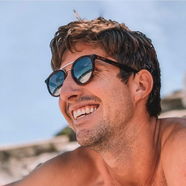 Man at beach wearing sunny days sunglasses
