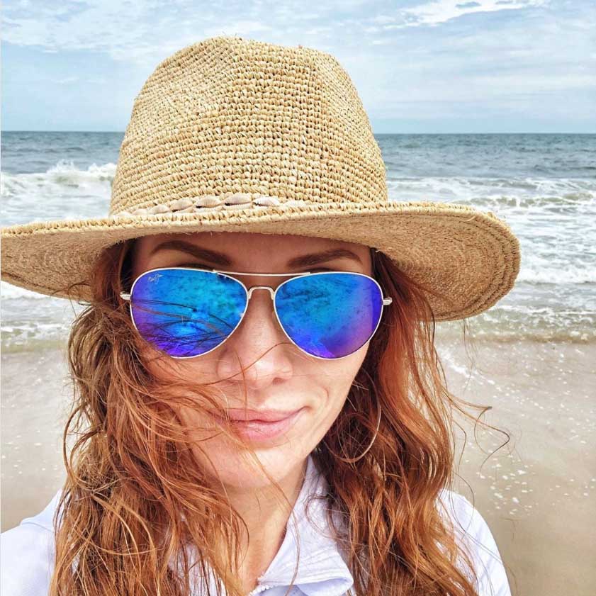 Woman at the beach wearing Mavericks