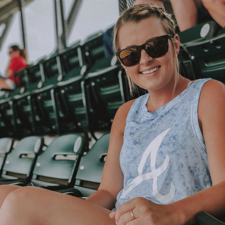 Girl in baseball stadium with Maui Jim Sunglasses
