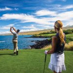 Couple Golfing on Green with sunglasses