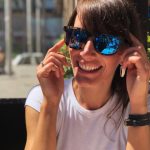 Woman in white shirt wearing Blue Hawaii Talk Story Sunglasses