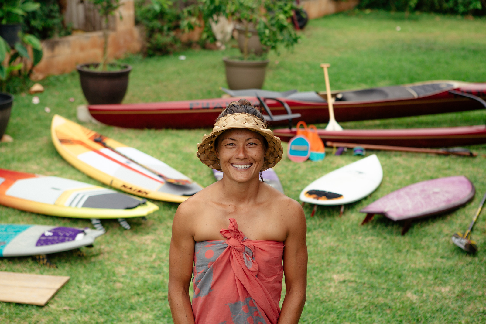 Markio Lum with surfboards and canoe