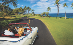 Couple in White Convertible by Ocean