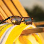 Sunglasses resting on beach chair