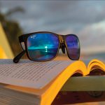 Sunglasses sitting on a book