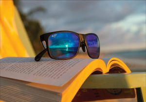Sunglasses sitting on a book