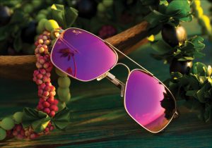 Pink lens sunglasses on floral background