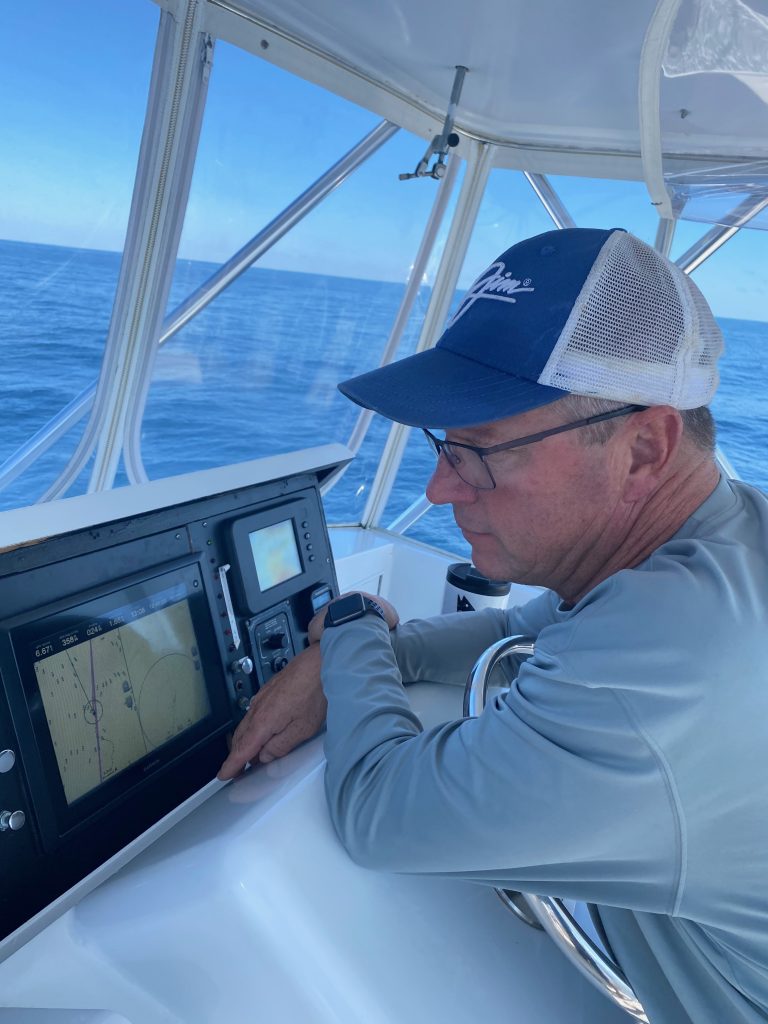 Greg at the helm