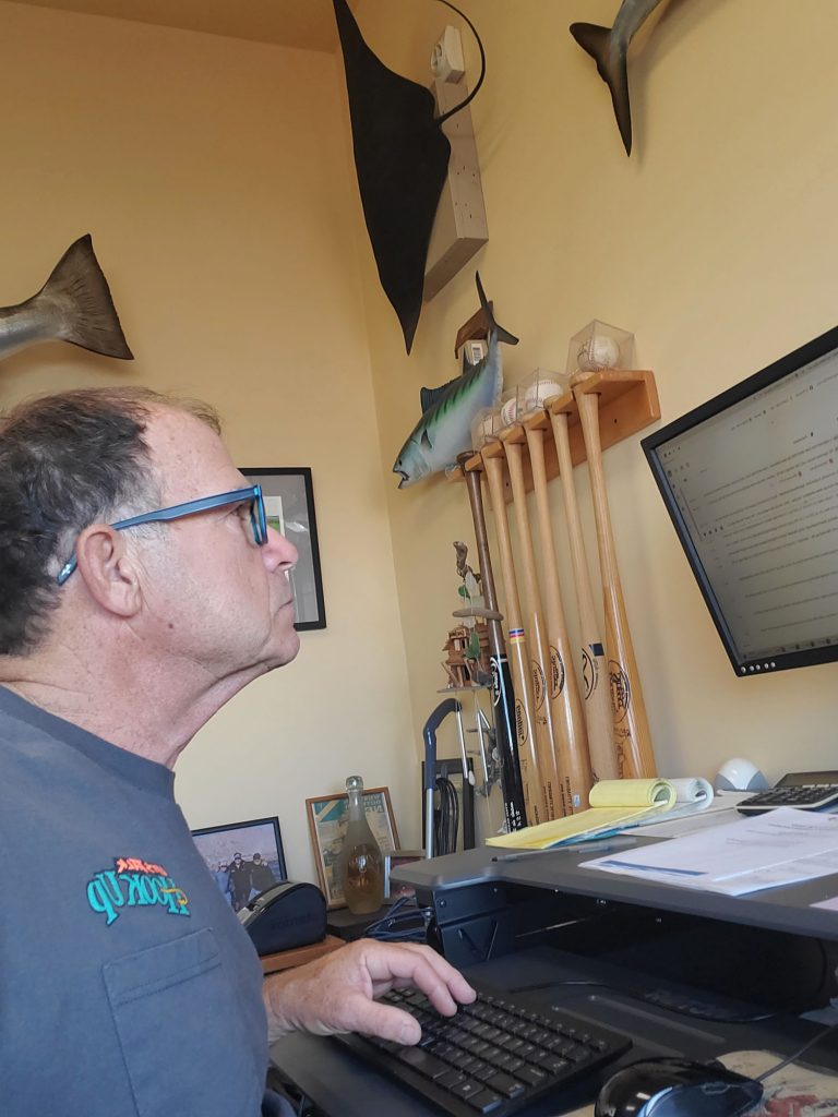 Pete Gray wearing Maui Jim eyewear on his computer