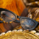 Lychee sunglasses with Black with Tokyo Tortoise Frames and Neutral Grey Lens on woven basket