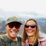 Kainoa and Mariko smiling in Maui Jim sunglasses