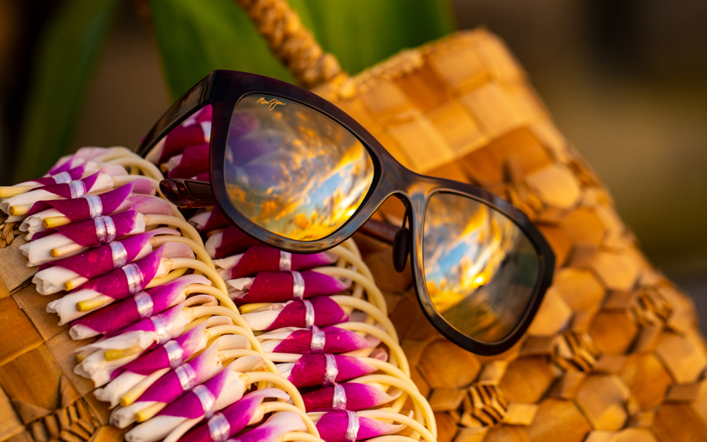 Anuenue sunglasses on woven basket