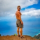 A man posing on a cliff