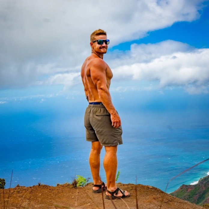 A man posing on a cliff