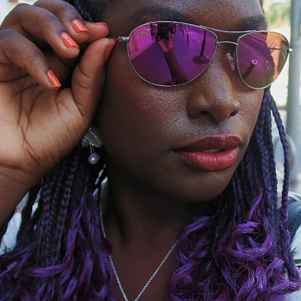 A woman taking a closeup of a selfie