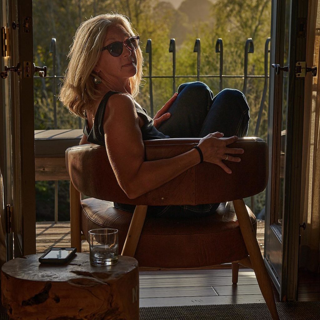 A woman posing in a living room