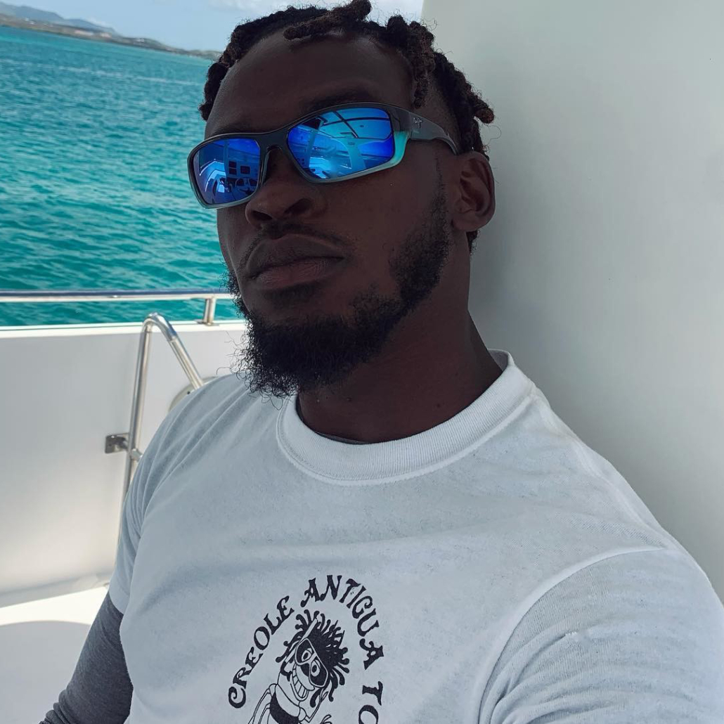 Man on a boat in the middle of the sea