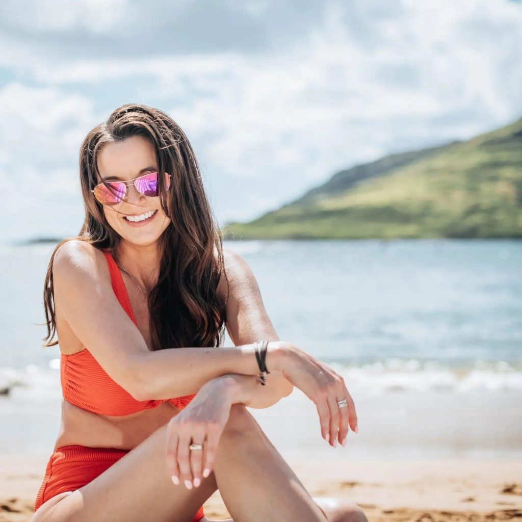 A woman posing on the beach