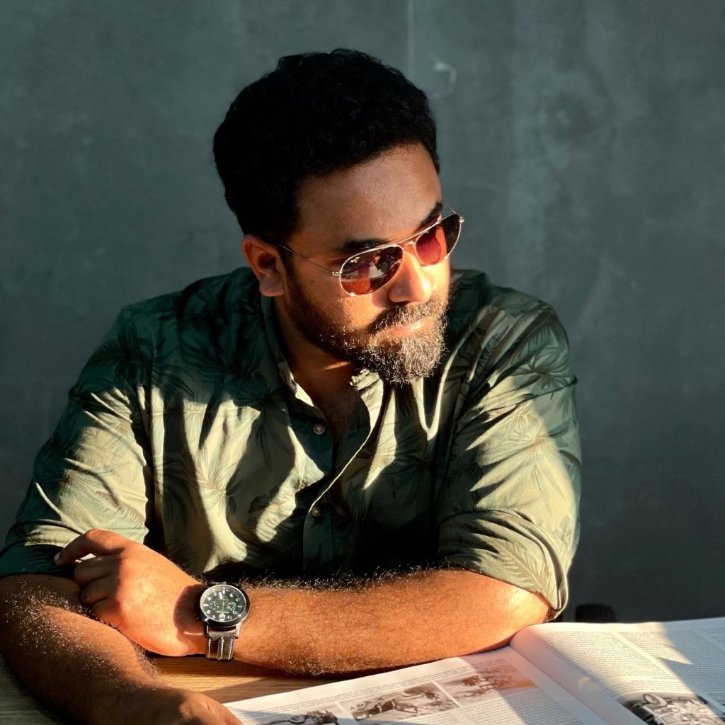 A man in glasses reading