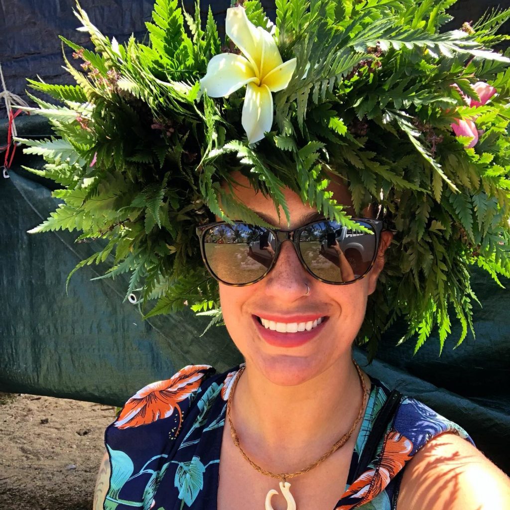 A woman with a botanical hairdo