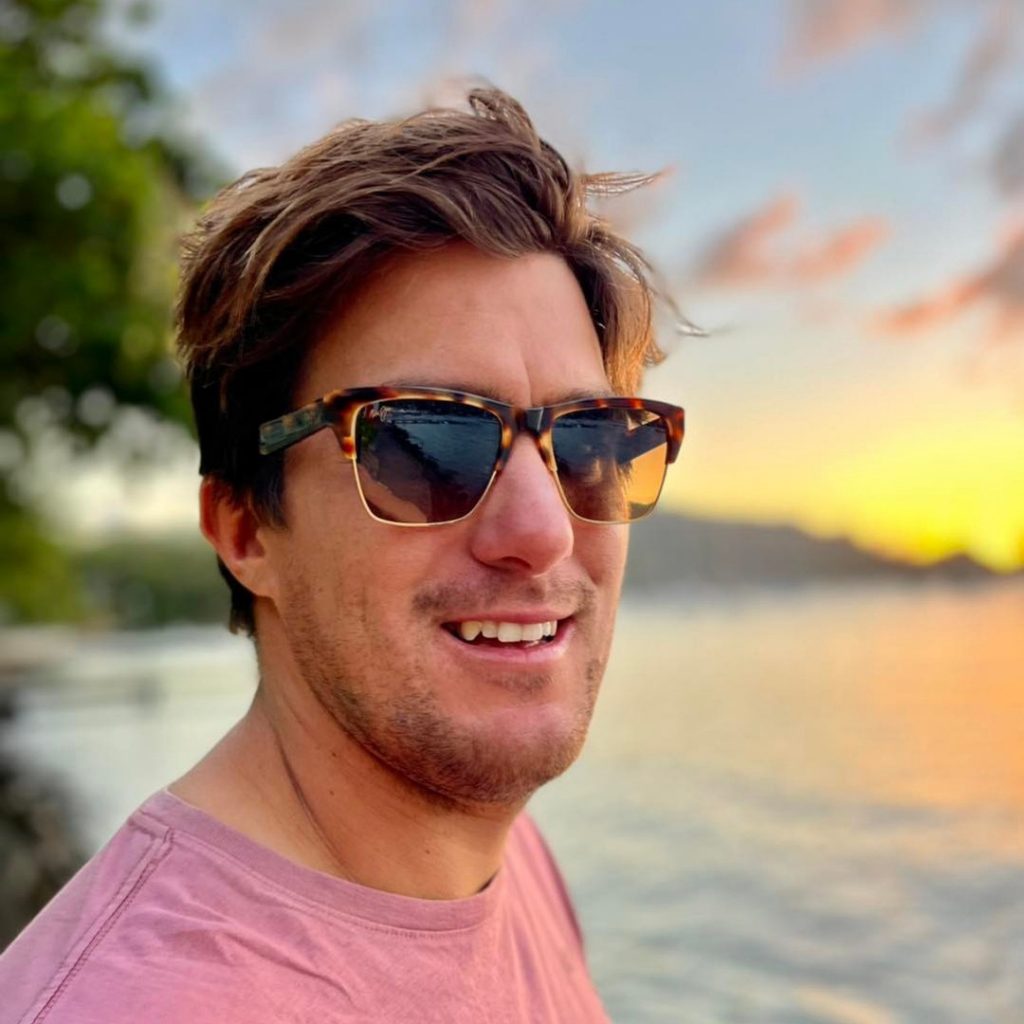 A man on the beach in the sunset