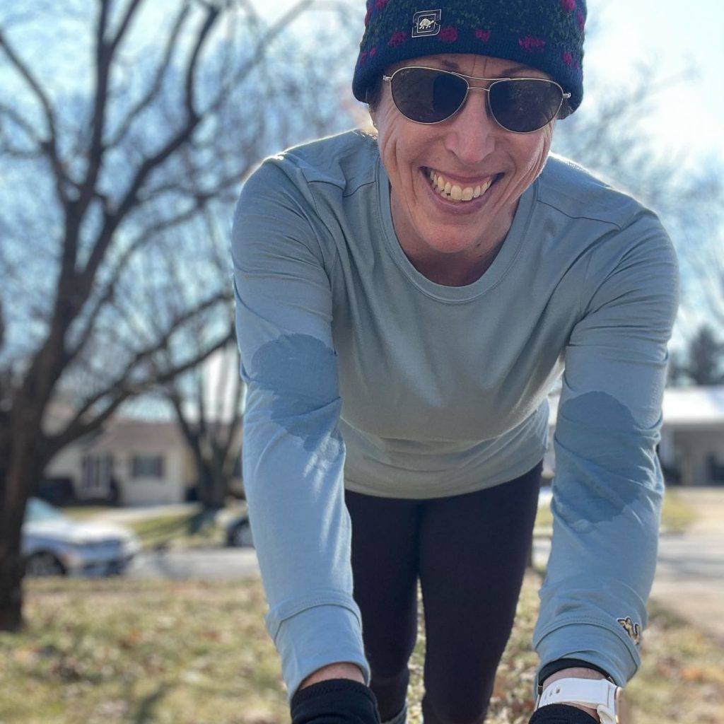 A woman just done exercising posing for the camera